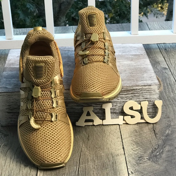 nike shox gravity metallic gold